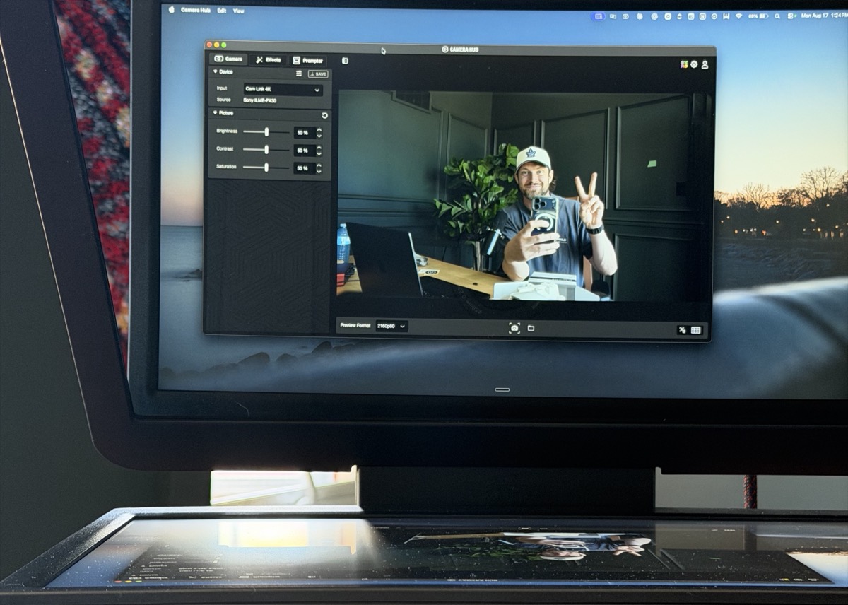 Camera Hub open on screen with brightness, contrast and saturation sliders